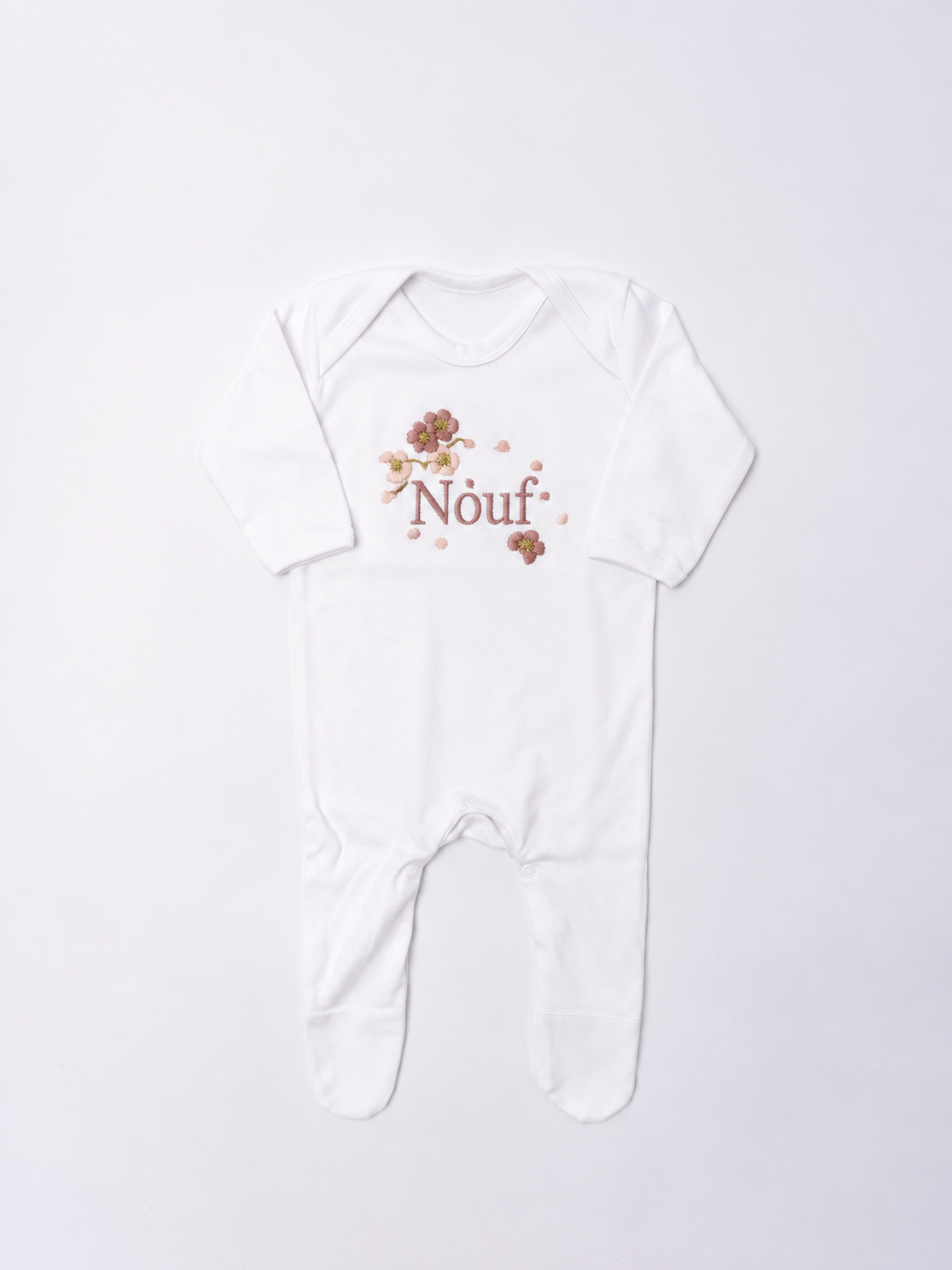 Blossom personalised Baby Romper: luxury romper suit embroidered to order in Britain with you baby's name and a tumbling cherry blossom design