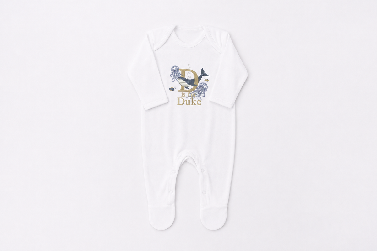 Underwater Personalised Baby Romper: luxury roper suit embroidered to order in Britain with your baby's name, surrounded by whales, jellyfish and fish